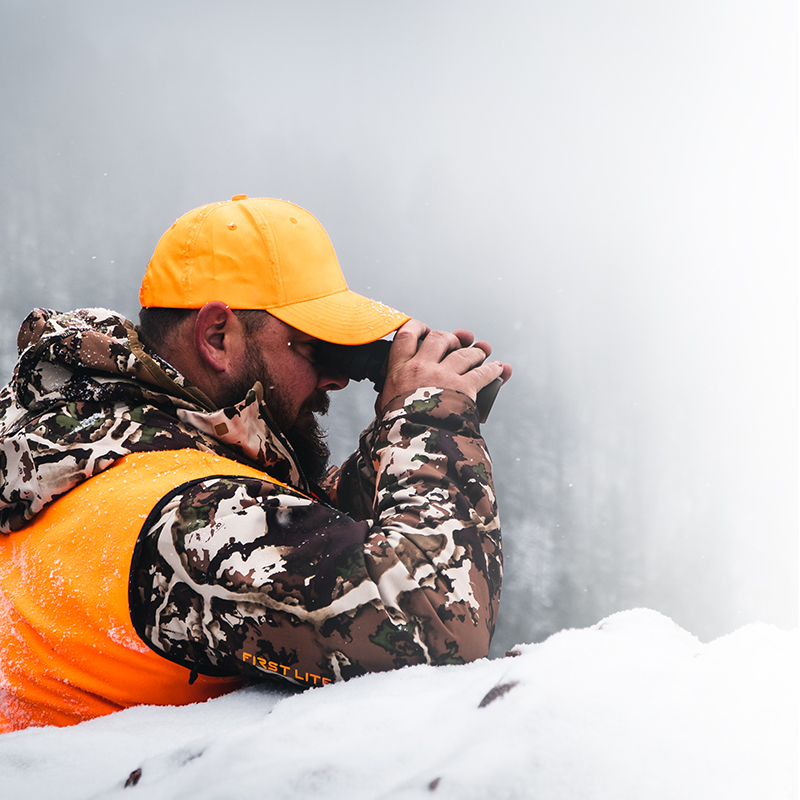 a hunter in hunters orange glassing